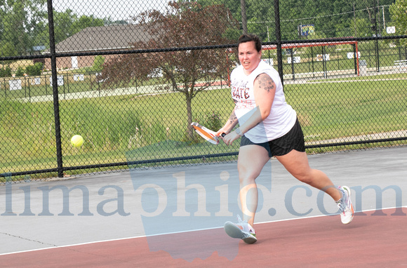 Jennifer Allgire races to return the ball to her opponent on Sat