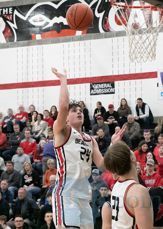 Spencerville's Carder Orr (#24) shoots as teammate, Carter Sudho