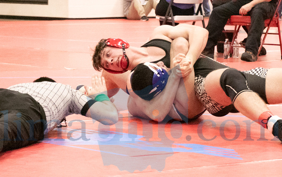 Spencerville's Maddox Jurek (Top) pins his opponent, Madeira's R