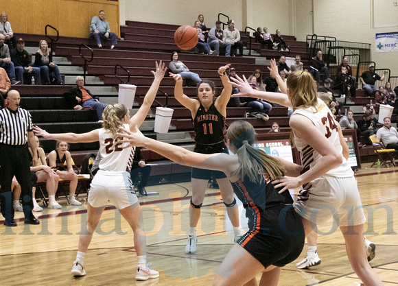 Minster's Addi Inskeep (#11) passes the ball to teammate, Lydia