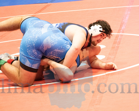 Allen East's Brogan Paxson (Right) works to pin his opponent, Wi
